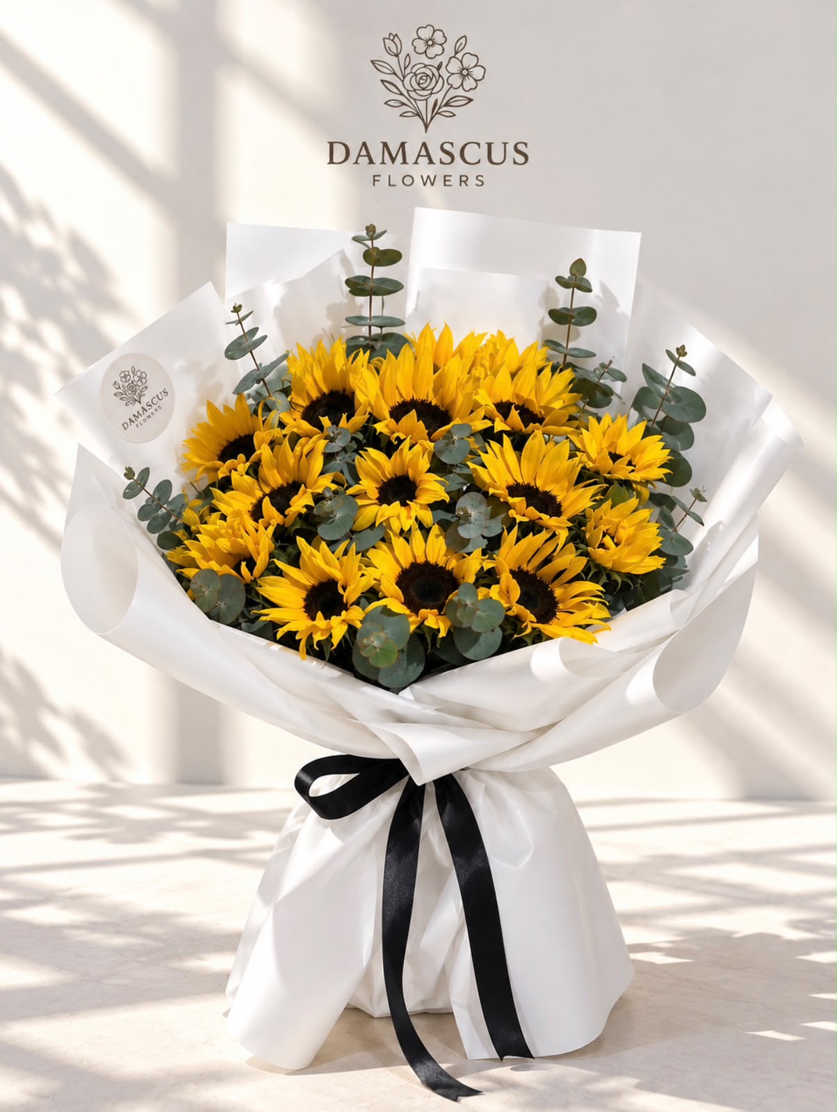 باقة إشراقة الشمس بتغليف أبيض — Damascus Flowers